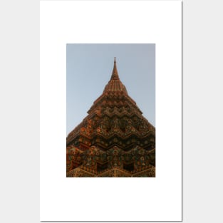 First low angle view of a Buddha stupa reaching symmetrical in the clear sky. Posters and Art